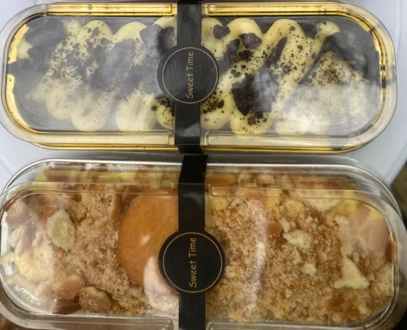 Two mini cakes, one in a gold-trimmed box